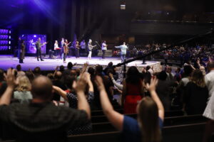 2023 campmeeting photo people at Rhema Bible Church and the singers on the altar.