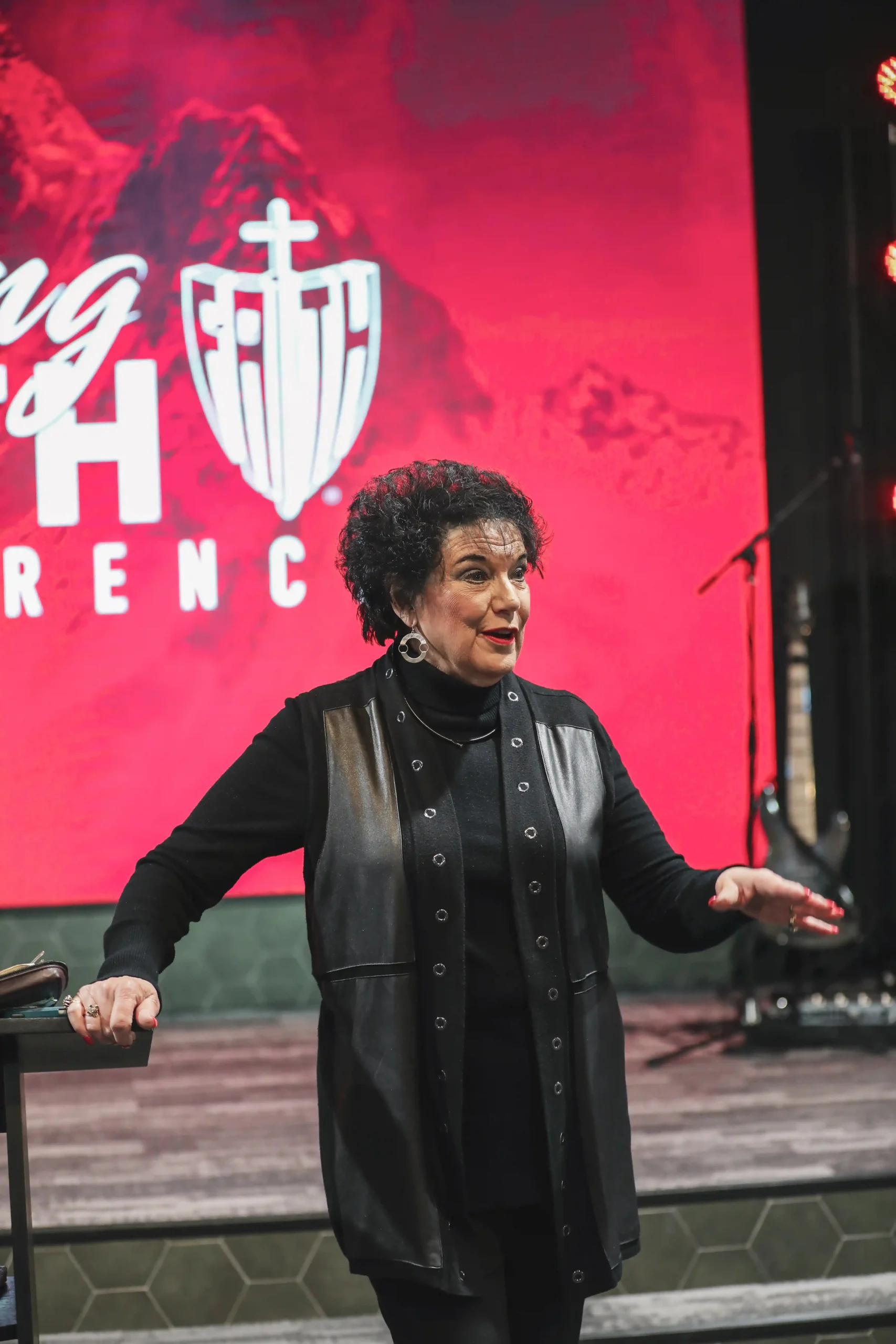 Lynette Hagin preaching red background