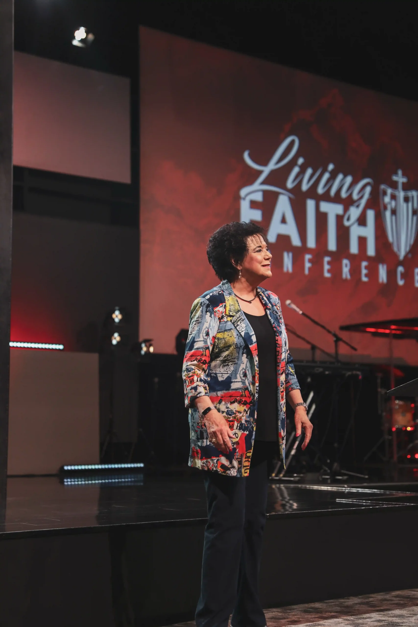Lynette Hagin preaching red background with colorful suit