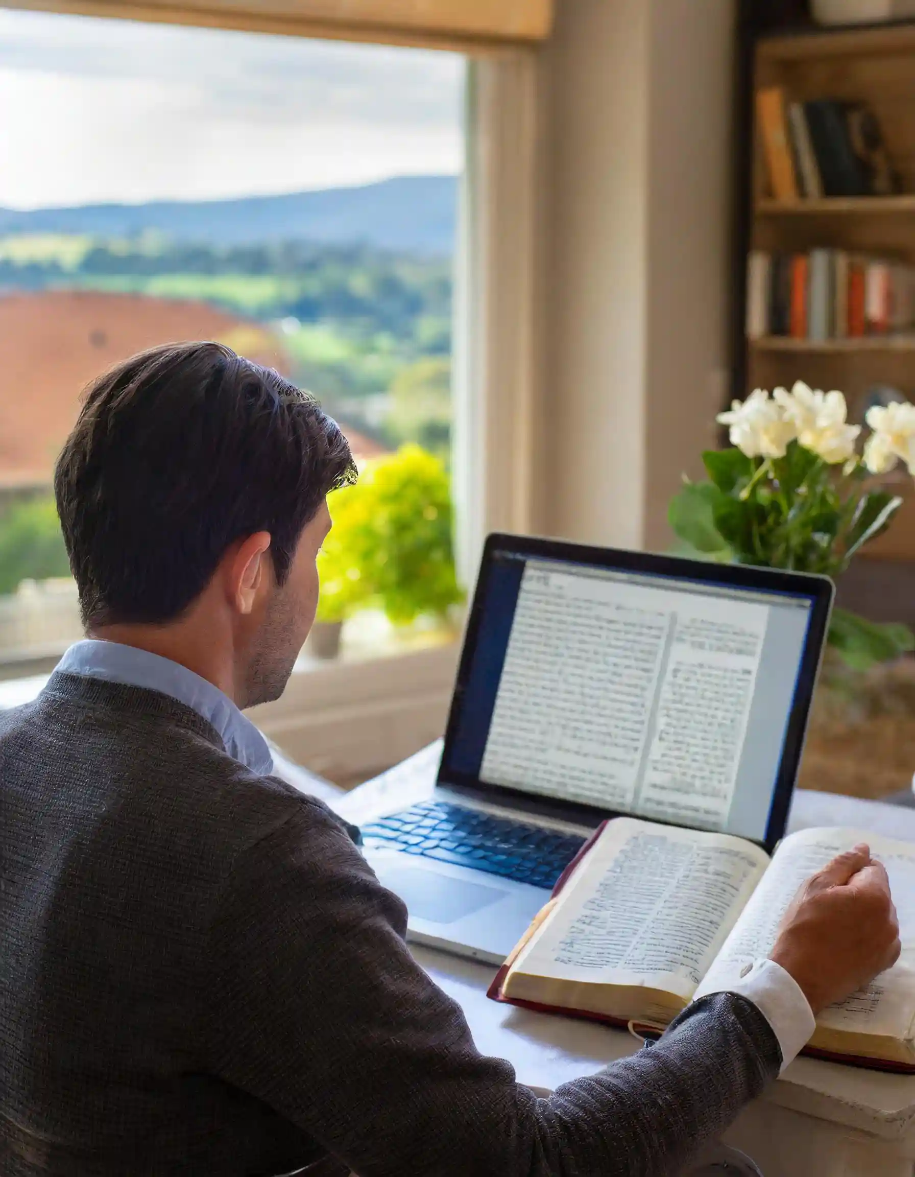 Person reading an article on the laptop