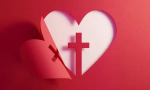 Heart shape with a cross in a red paper
